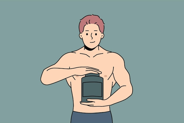 Muscular man holds jar of protein and recommends taking sports nutrition while doing bodybuilding Strong guy with big muscles on arms takes protein to achieve outstanding result from training