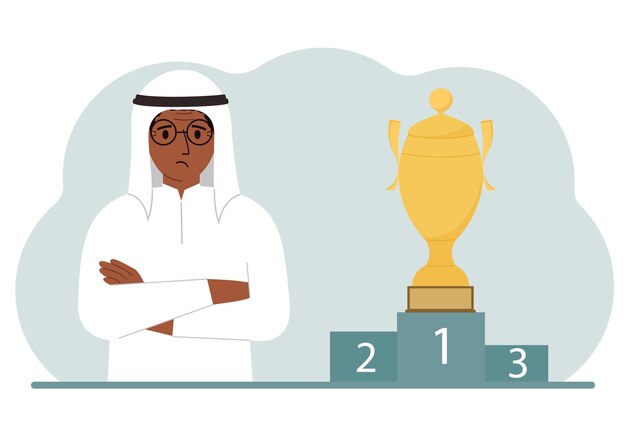 A muslim man next to the pedestal on which the cup for victory and first place