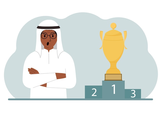 A muslim man next to the pedestal on which the cup for victory and first place