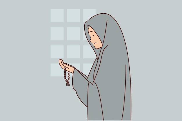 muslim woman dressed in chador prays in mosque or performs namaz asking allah for help