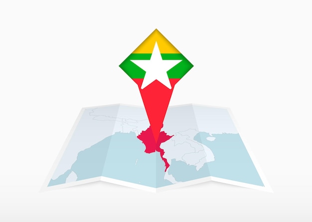 Il myanmar è raffigurato su una mappa di carta piegata e con un marcatore di posizione con la bandiera del myanmar.