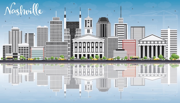 Skyline di nashville con edifici grigio, cielo blu e riflessioni.