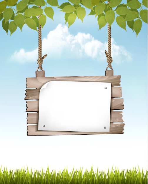 Natural background with leaves and a wooden sign.