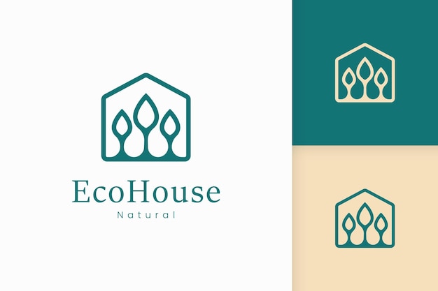 Логотип зеленого дома природы с формой дерева и листа