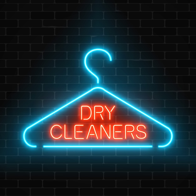 Vector neon dry cleaners glowing sign with hanger on a dark brick wall background.