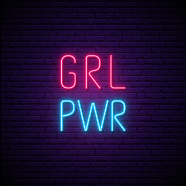 Neon girl power-tekst op donkere bakstenen muur