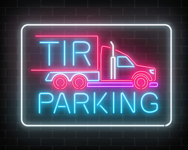 Neon glowing tir parking sign on a dark brick wall glow signboard of a long vehicle truck and truckers.