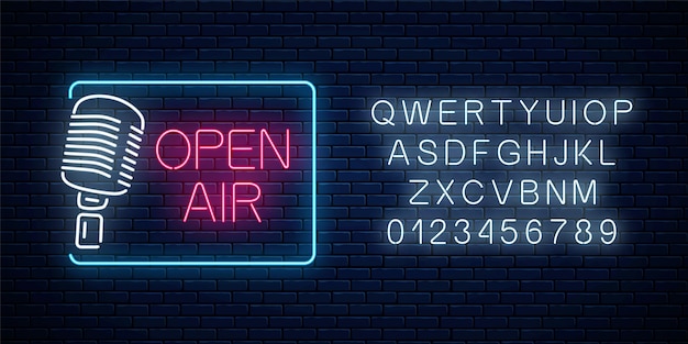 Neon open-air signboard with microphone and alphabet