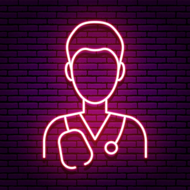 Neon sign in the form of an icon of a male doctor. Red colors on a brick wall background. A phonendoscope rests on his shoulders. Isolated.