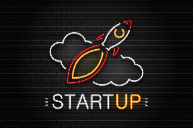 Neon sign of rocket and clouds for decoration on the wall background. realistic neon logo for startup. concept of business and success.