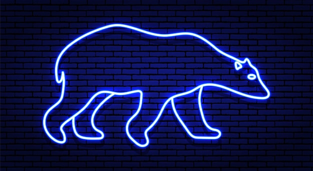 Segno di inverno al neon. il contorno dell'orso polare bianco nei toni del blu. contro un muro di mattoni, con un'ombra.