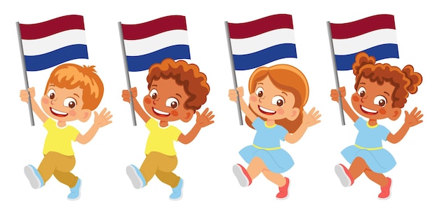 手にオランダの旗。旗を持っている子供たち。オランダの国旗