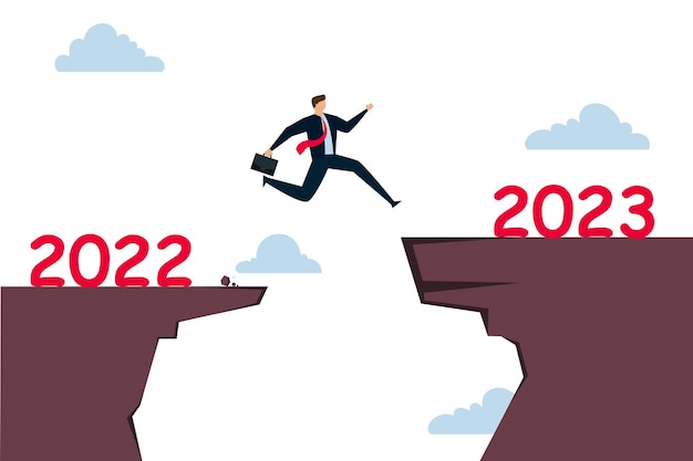 Новый 2023 год, надежда на восстановление бизнеса, изменение календаря с 2020 на 2021 год или новый вызов, предстоящая концепция, уверенный в успехе бизнесмен, пытающийся прыгнуть высоко, преодолеть риск и перейти к следующему утесу.