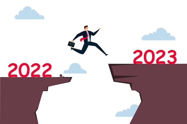 New year 2023 hope for business recovery change year from 2020 to 2021 calendar or new challenge coming concept confident success businessman attempt to jump high overcome risk to next cliff