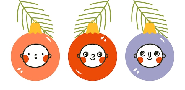 New Year's toys on the branches of the Christmas tree with cartoon cute baby's faces.