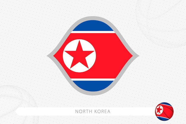 North Korea flag for basketball competition on gray basketball background.