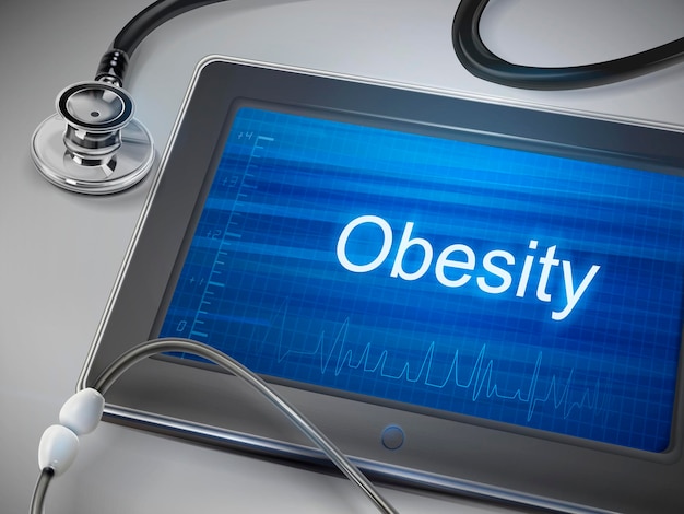 obesity word displayed on tablet