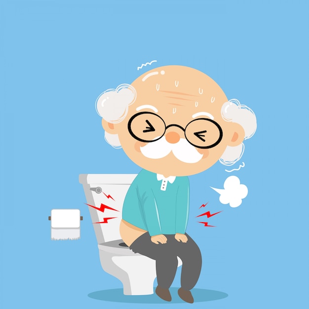 The old man was defecating in the toilet with difficulty and serious like bad health. 