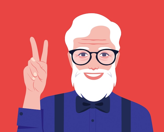 An old stylish bearded man with glasses smiles and shows a victory sign Happy oldness Grandfather