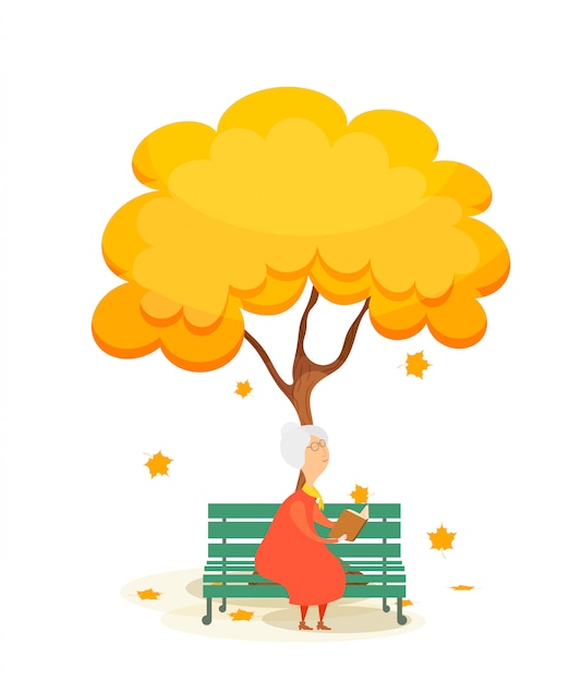 The old woman on the bench. elderly woman on a park bench, reading a book under a autumn yellow tree. falling maple leaves. autumn time