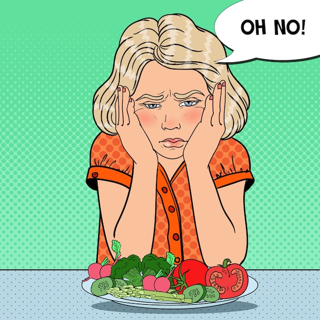Ongelukkig meisje met plaat van verse groenten