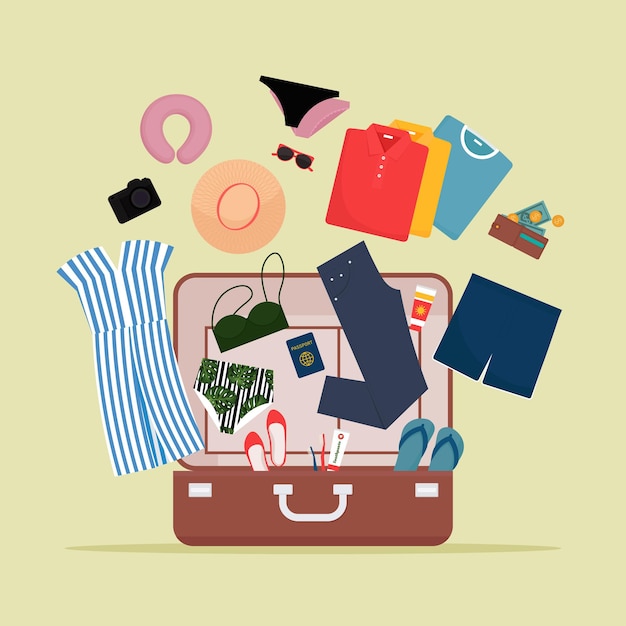 Открытый багаж с одеждой и дорожными предметами