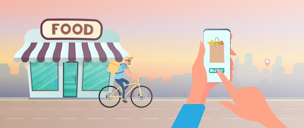 Order food at home. The guy is lucky to order food on a bicycle. Hand holds smartphone.