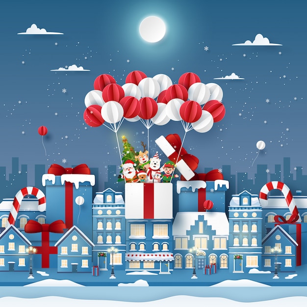 Origami paper art of cute christmas character on balloon in town with snowing