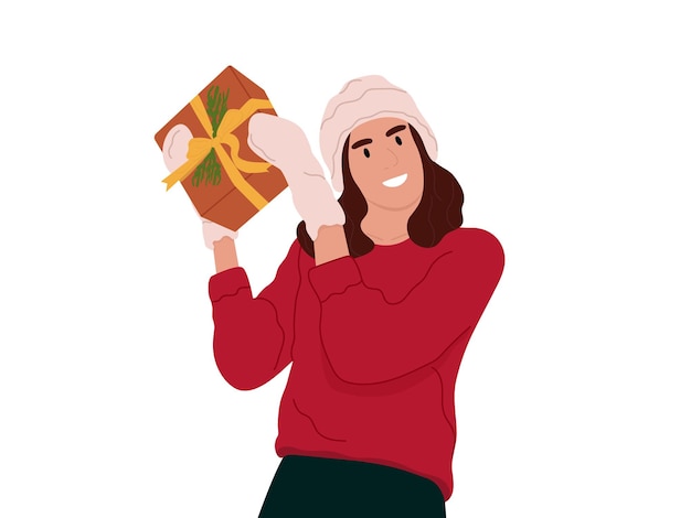 Overjoyed young woman holding a giftHoliday gift giveaway love congratulationChristmas New Year