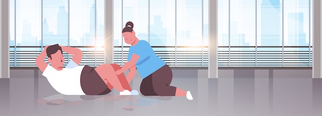 Paar doen sit-ups man vrouw samen oefenen training training gewichtsverlies concept modern