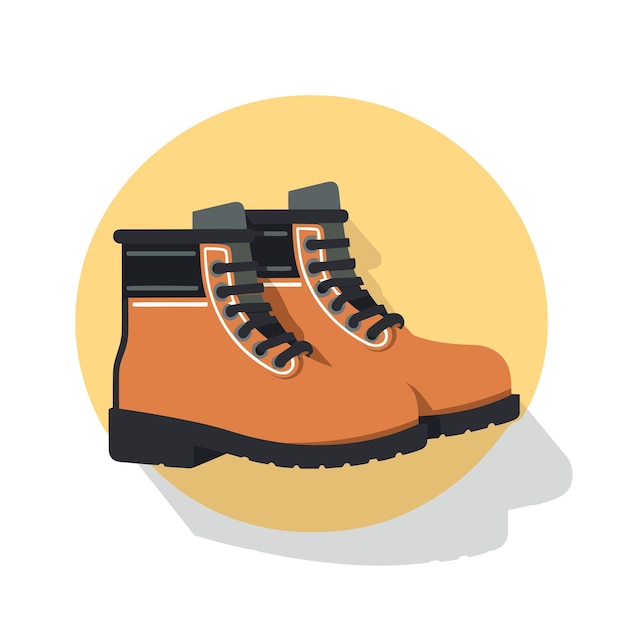 A pair of orange boots sitting on top of a yellow circle