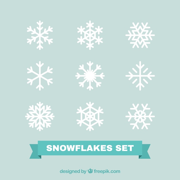 Pak van witte decoratieve sneeuwvlokken in plat design