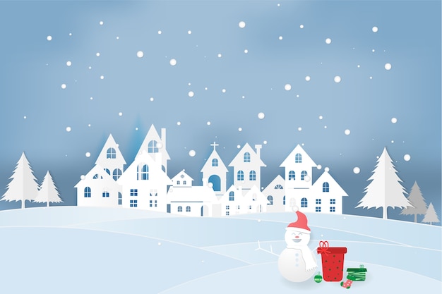 Бумажное искусство снеговика с городом и рождественским днем