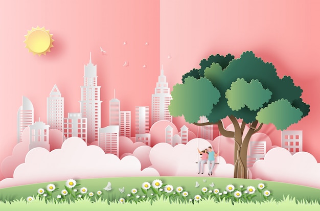 Paper art style of cute couple sitting on a swing under a tree in a big city.