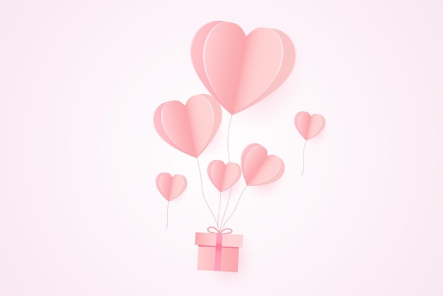 Arte di carta del festival di san valentino con palloncini a forma di cuore e confezione regalo.