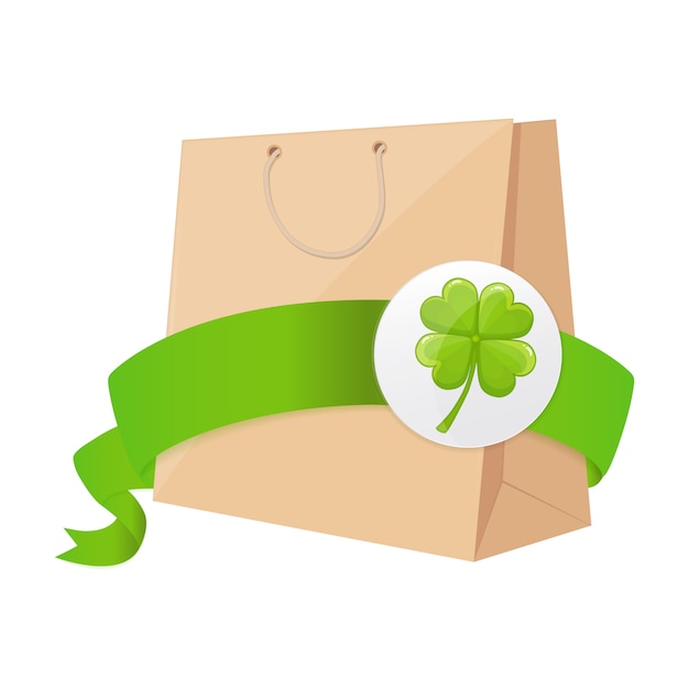 Paper bag with green ribbon and four-leaf clover