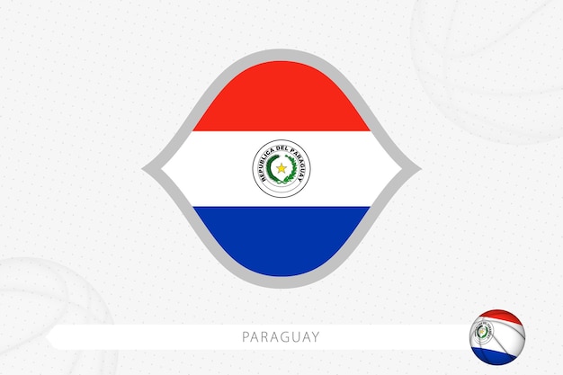 Paraguay flag for basketball competition on gray basketball background.