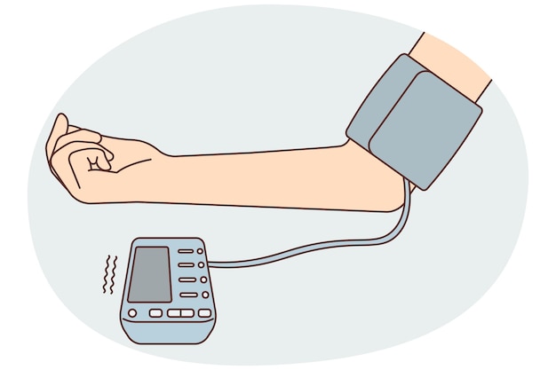 patient hand with blood pressure monitor