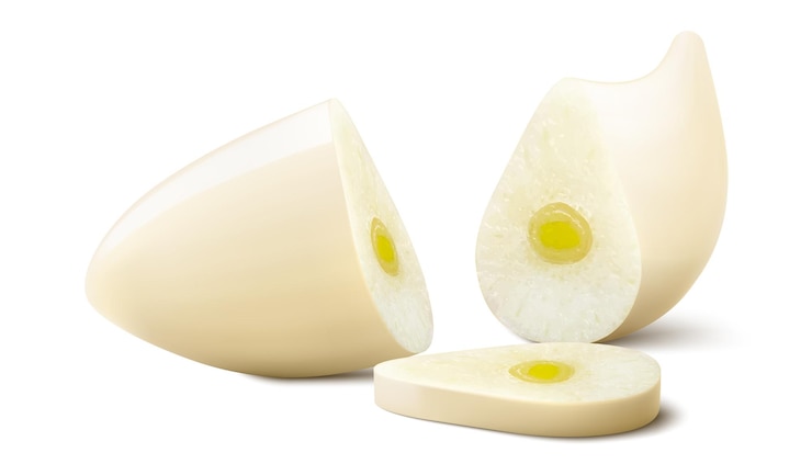 Vector peeled and chopped garlic clove isolated on white background slices of garlic clove for cooking
