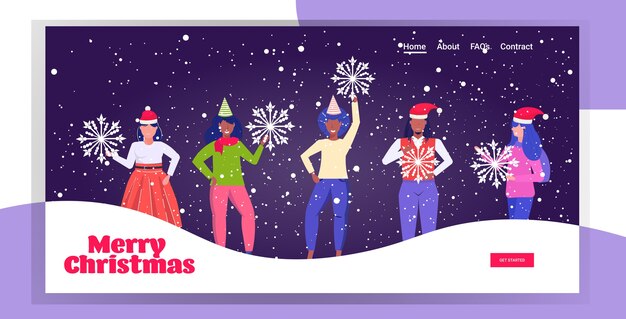 雪片を持っているサンタの帽子をかぶった人々メリークリスマス明けましておめでとうございます冬休みのお祝いのコンセプトミックスレース男性女性一緒に立って楽しいランディングページ