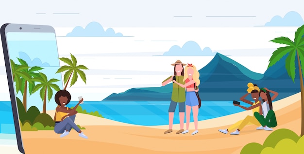 Vector people using cellphones mix  men women relaxing on tropical island sea beach summer vacation digital addiction concept smartphone screen mobile app  full length horizontal