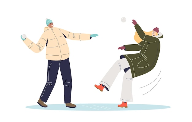 People in winter clothing playing snowballs. Young man and woman snow ball fight. Winter games and activities.