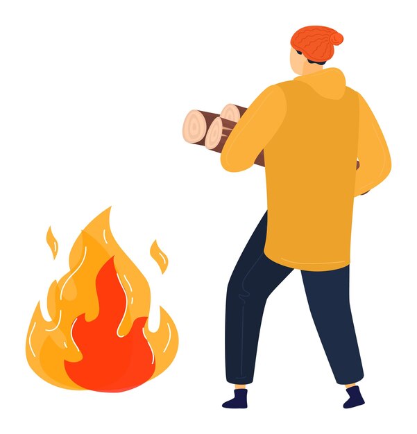 Persona con giacca gialla e cappello rosso che trasporta legna da ardere per un falò all'aperto e attività di campeggio