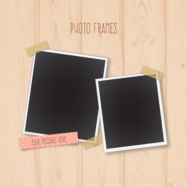 Photo frames on a wooden background