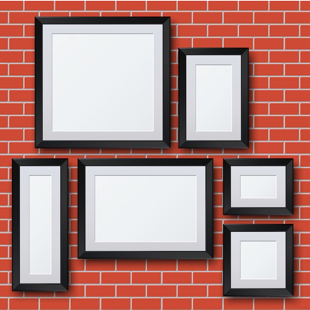 picture frames on brick wall