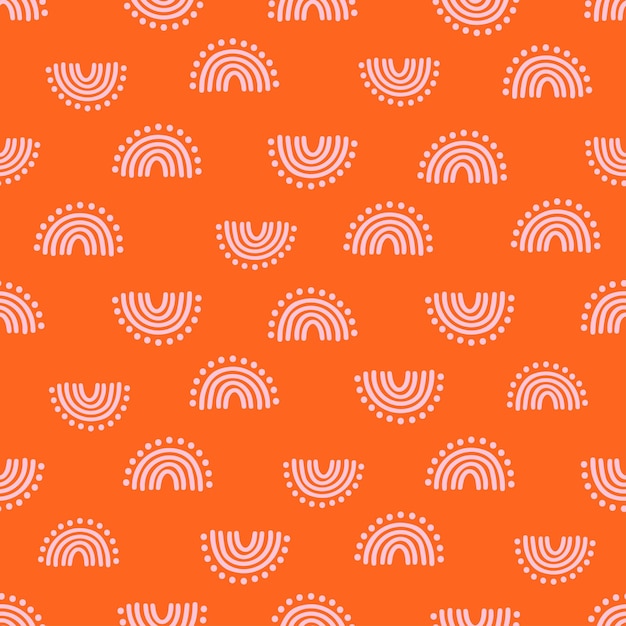 Pink hand drawn rainbow with dots seamless pattern with orange background.