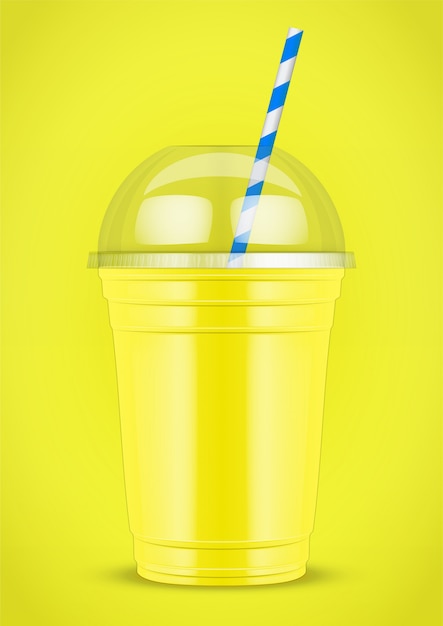 Plastic cup with smoothie and tube.