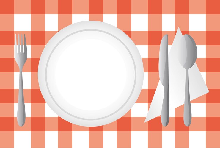 Vector plate and cutlery over red tablecloth vector illustration