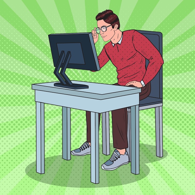 コンピューターで働くポップアートの目の弱い男