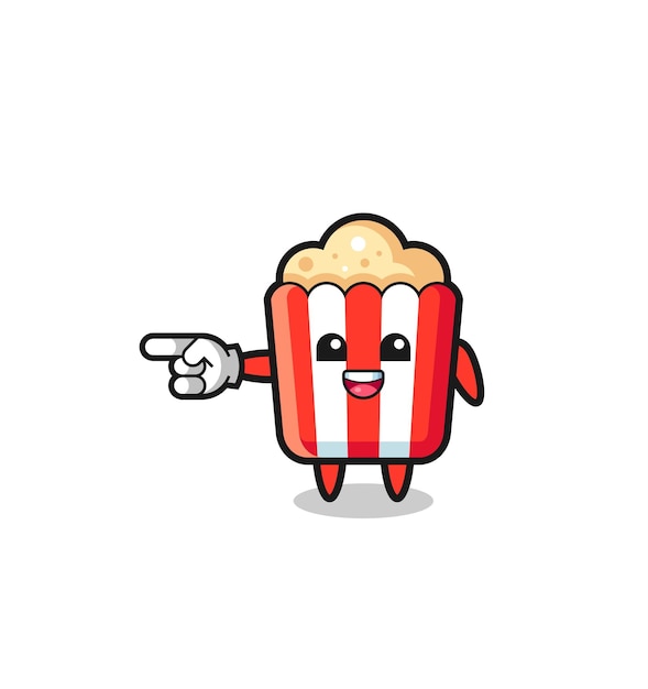 Popcorn cartoon met wijzend naar links gebaar schattig ontwerp